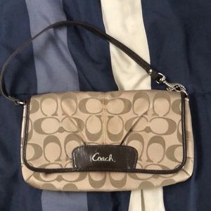 Coach Wristlet fairly new used a hand full